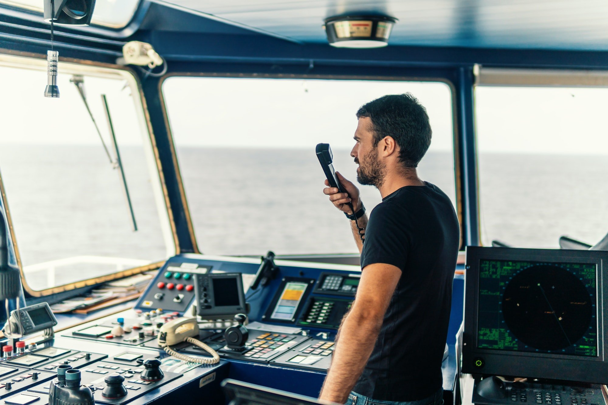 Marine navigational officer is reporting by VHF radio
